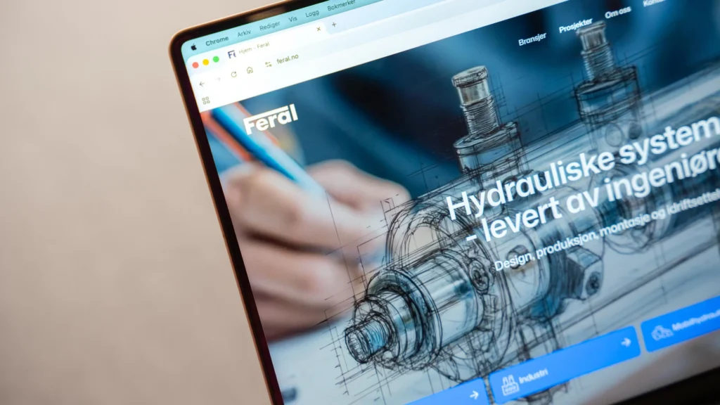 Feral nettside viser teknisk tegning av hydrauliske komponenter på laptop